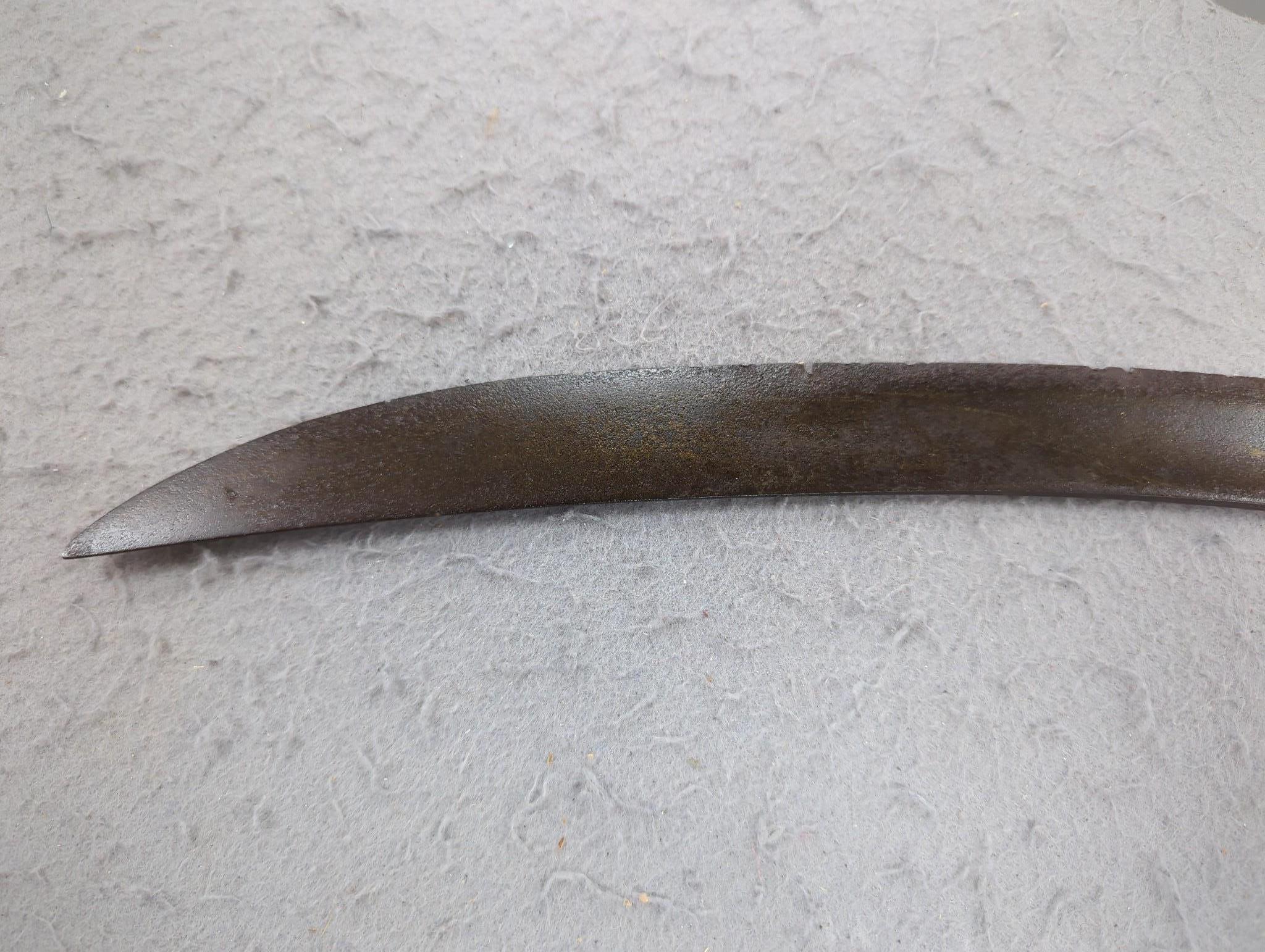 A reproduction cavalry sabre and a bayonet fixing
